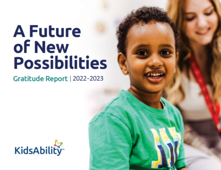 Download the Gratitude Report, the cover features a smiling child with a woman in the background and the words "A future of new possibilities, gratitude report 2022-2023"